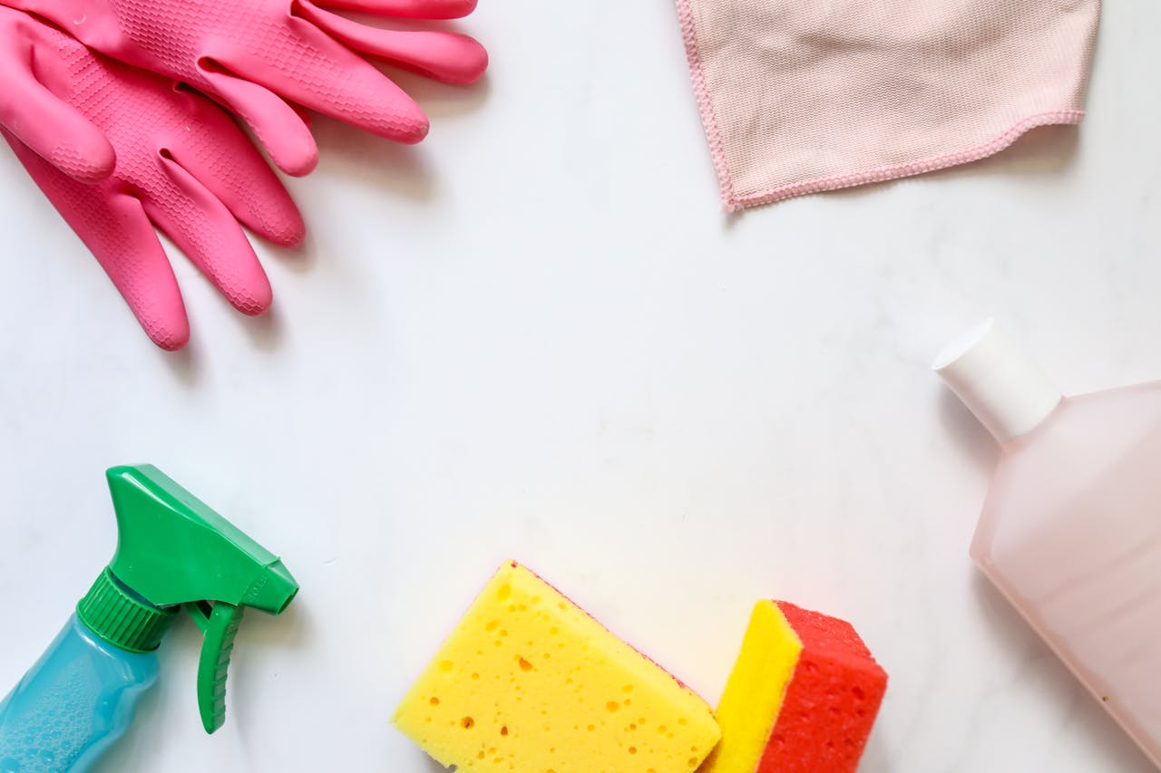 journey A flat lay of assorted cleaning supplies, perfect for housekeeping themes.